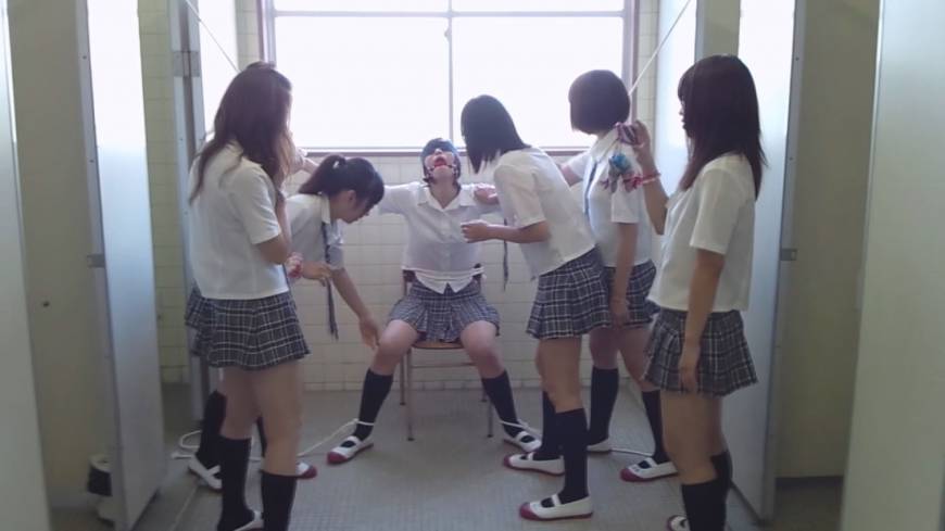 Thallium Girl getting rough treatment from her classmates (Picture courtesy of The Japan Times)